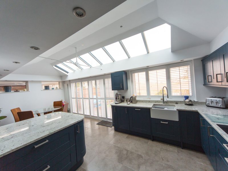 large roof lantern and upvc white windows in a modern kitchen