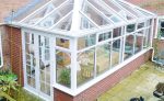 Edwardian conservatory with a glass roof and Georgian bar French doors