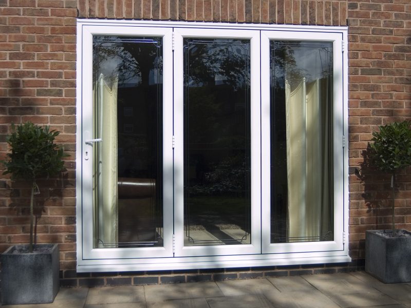 Closed three leaf white uPVC bifold doors