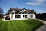 Victorian style home with three extensions with a large front lawn