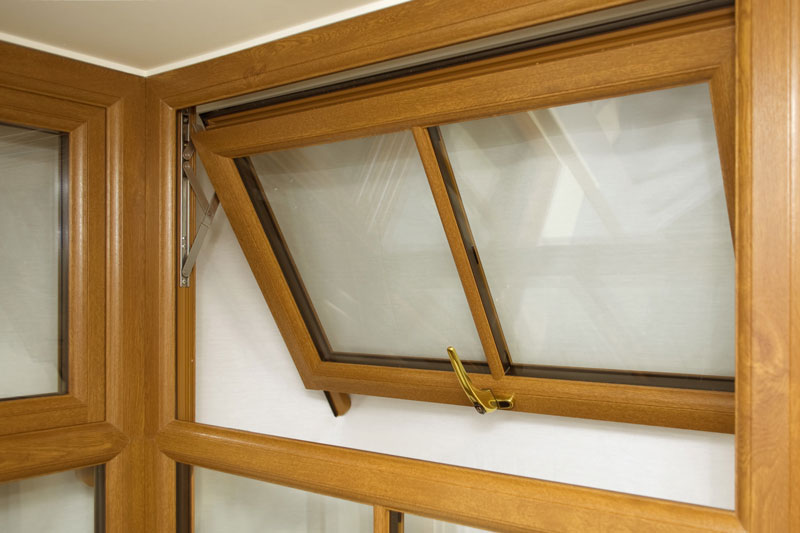 light brown vertical casement window