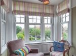 Sliding sash flag windows in a conservatory extension