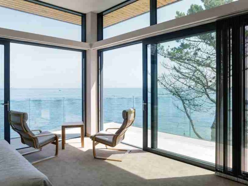 bright sunny room with wall filling aluminium sliding doors