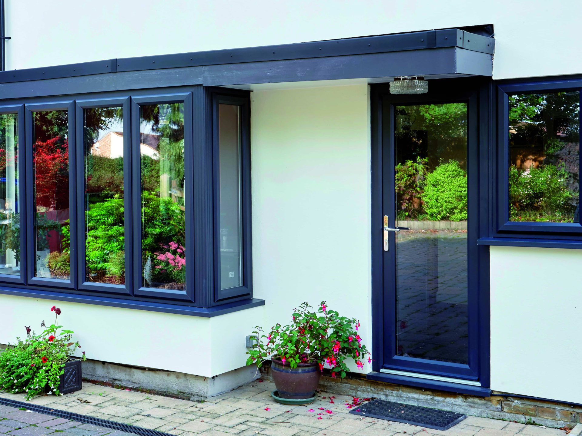 grey upvc casement windows and a double glazed back door with silver hadware